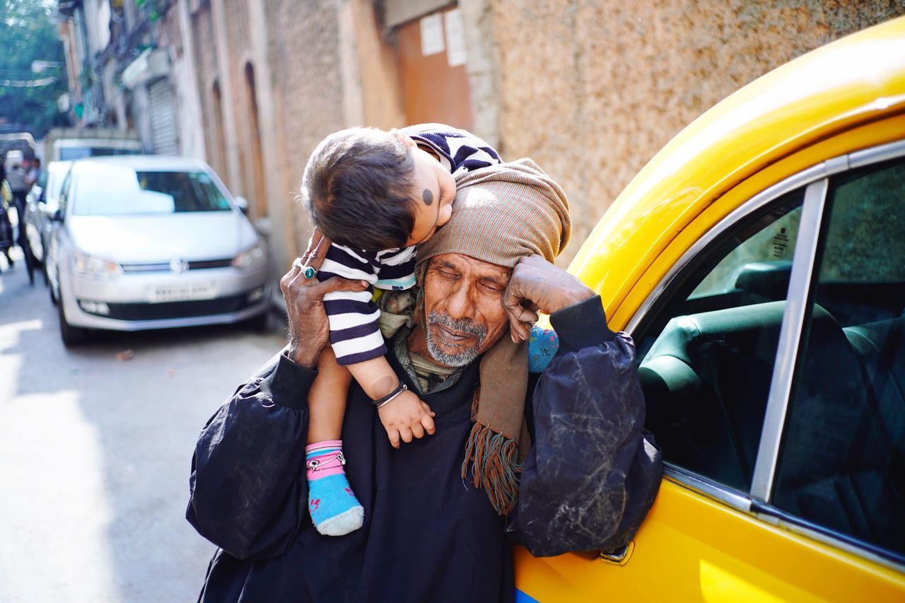car, motor vehicle, two people, transportation, mode of transportation, togetherness, bonding, child, childhood, love, parent, adult, females, real people, men, women, males, land vehicle, lifestyles, positive emotion, son, daughter, outdoors