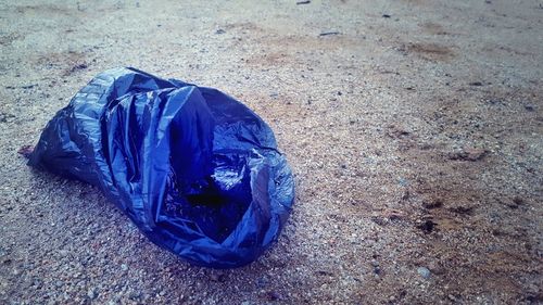 High angle view of garbage on sand