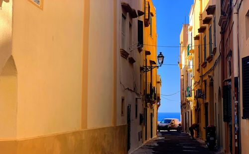 Narrow alley amidst buildings in city