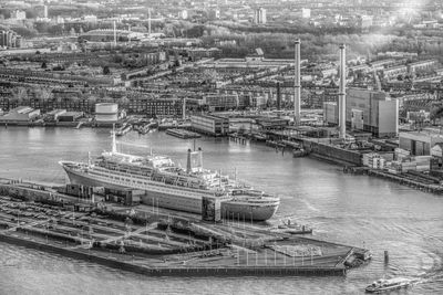 High angle view of harbor by river in city