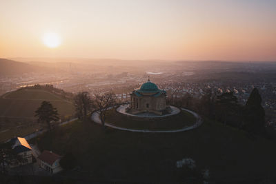 High angle view of buildings against sky during sunset