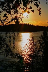 Scenic view of lake against sky during sunset