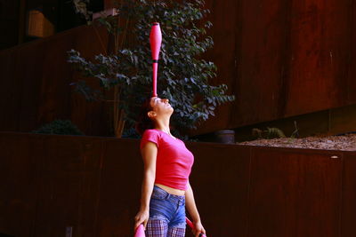 Girl standing on pink flower