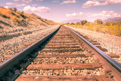 View of railroad tracks against sky in utah