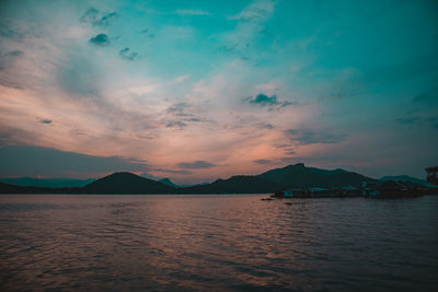 Scenic view of sea against sky at sunset