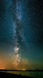 Scenic view of sea against sky at night