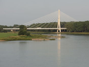 Scenic view of bridge over river against clear sky