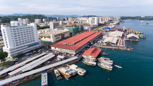 High angle view of buildings by sea