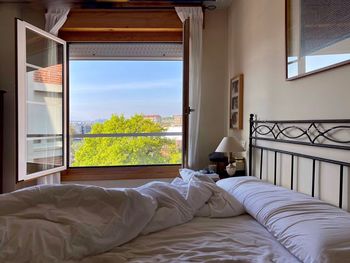 Bedroom interior with opened window