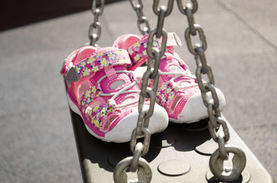 High angle view of shoes on swing