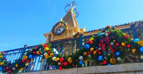 Low angle view of christmas tree against building