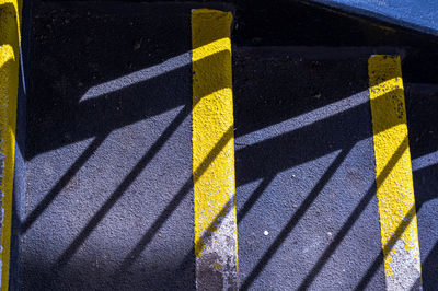 High angle view of yellow umbrella on road