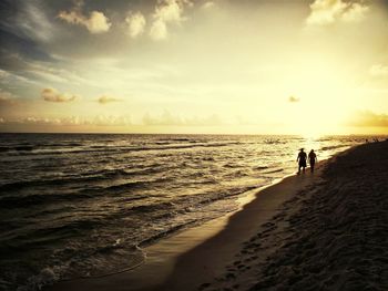 Scenic view of sea against sky at sunset