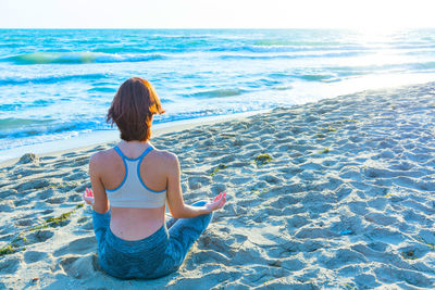 Rear view of woman at beach