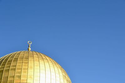 Low angle view of cathedral against clear blue sky