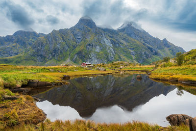 Scenic view of lake and mountains against sky