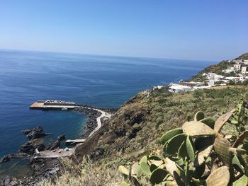 Scenic view of sea against clear blue sky