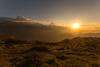 Scenic view of mountains against sky during sunset