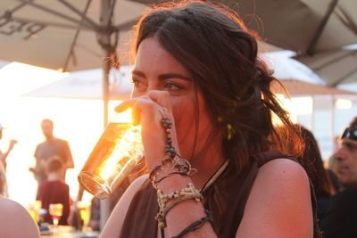 Close-up of young woman sitting outdoors