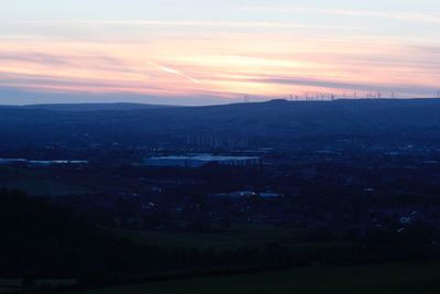 Scenic view of landscape against sky during sunset