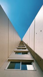 Low angle view of building against clear blue sky