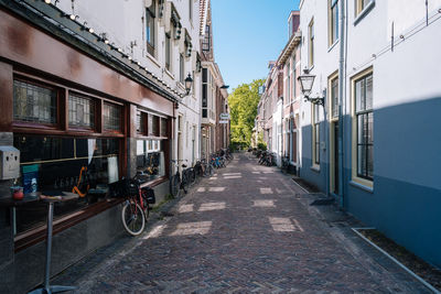 Street amidst buildings in city against sky