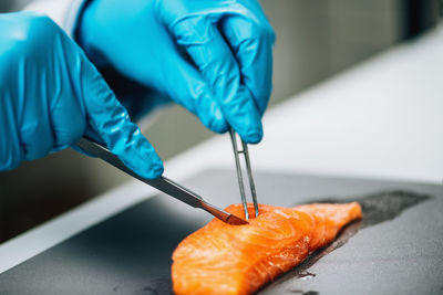 Food quality control of sea fish. quality control inspector analyzing salmon in a laboratory.