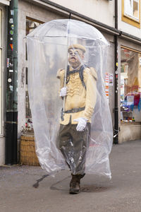 Basel, switzerland - february 21. carnival reveller in a makeshift hazmat dress costume