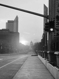 Street amidst buildings against sky