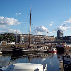 Boats moored at harbor