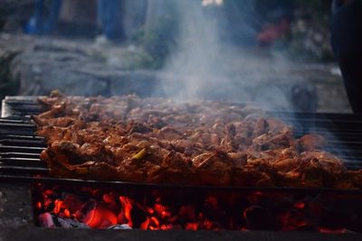 Close-up of meat on barbecue grill