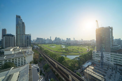 High angle view of buildings in city against clear sky