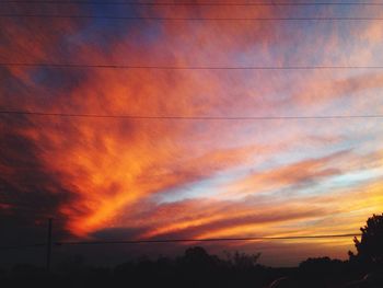 Scenic view of cloudy sky at sunset