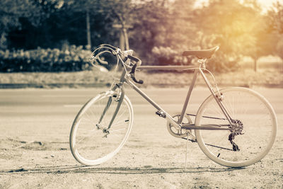 Bicycle leaning on field