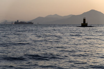 Scenic view of sea against clear sky during sunset