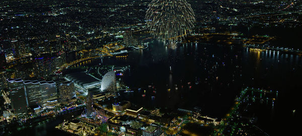 High angle view of city lit up at night,tokyo- japan