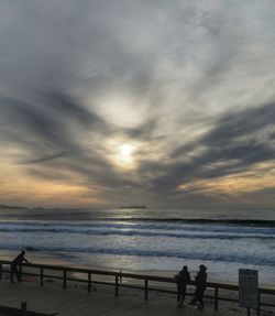 Scenic view of sea against cloudy sky