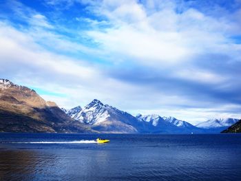 Scenic view of mountains against cloudy sky