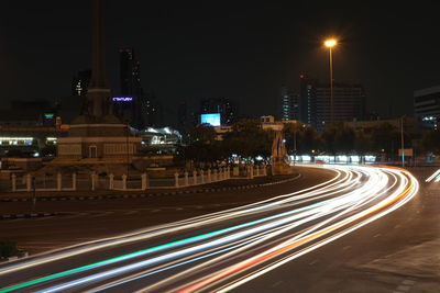 Light trails on road in city at night