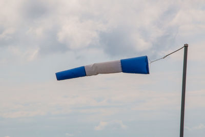 Low angle view of information sign against sky