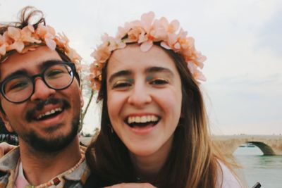 Out of focus closeup portrait of couple with eye makeup and flower crown old bridge adana turkey