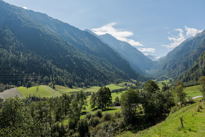 Scenic view of landscape and mountains against sky