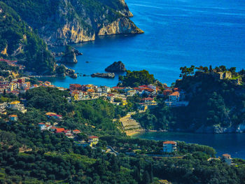 High angle view of townscape by sea