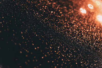 Close-up of fireworks against sky at night