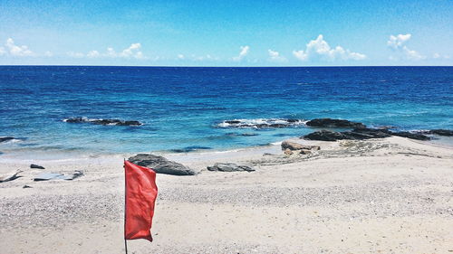 Red flag by beach