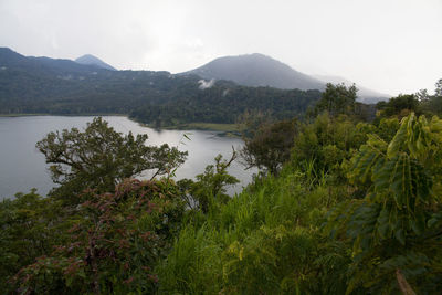 Scenic view of lake with mountains in background