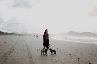 Front view of woman walking on beach