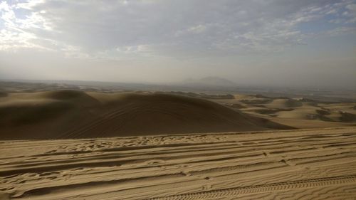 Scenic view of desert against sky