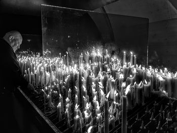 Panoramic view of man looking at illuminated stage