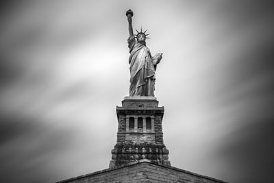 Low angle view of statue against sky